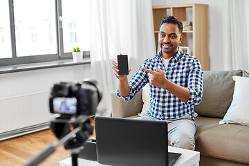 Image showing male blogger with smartphone videoblogging