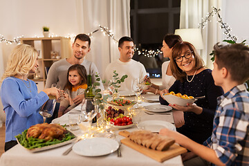 Image showing happy family having dinner party at home