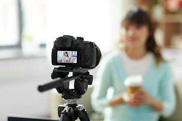 Image showing asian female blogger with coffee recording video