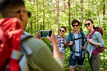 Image showing friends with backpacks being photographed on hike