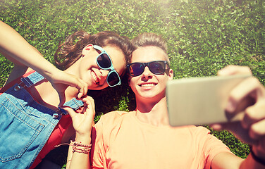 Image showing happy couple taking selfie on smartphone at summer