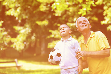 Image showing happy grandfather and child in park