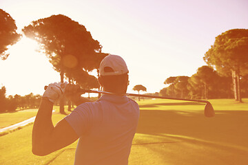 Image showing golf player hitting shot