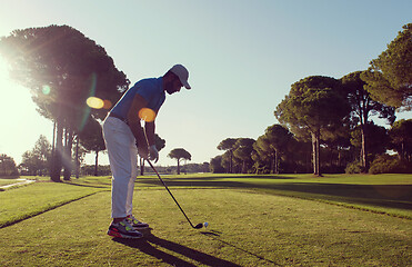 Image showing golf player hitting shot