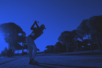 Image showing golf player hitting shot