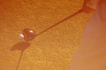 Image showing top view of golf club and ball in grass