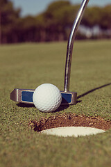 Image showing hitting golf ball to hole