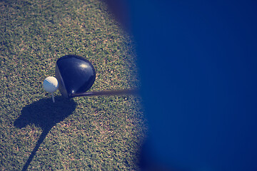 Image showing top view of golf club and ball in grass