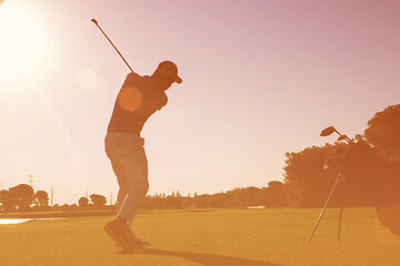 Image showing golf player hitting shot