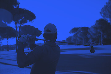 Image showing golf player hitting shot