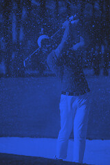 Image showing golfer hitting a sand bunker shot