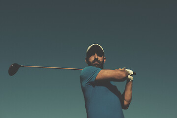 Image showing golf player hitting shot