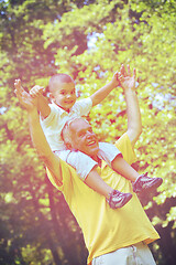 Image showing happy grandfather and child in park