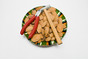 Image showing plate wit almond seeds and tools