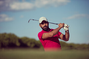 Image showing golfer hitting a sand bunker shot