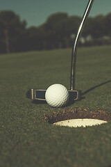 Image showing hitting golf ball to hole