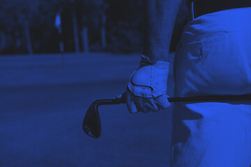 Image showing golf player close up hand and driver from back