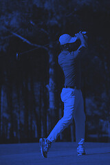 Image showing golf player hitting long shot