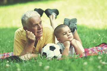 Image showing happy grandfather and child in park