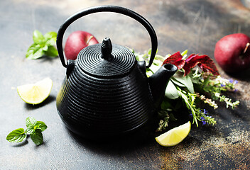 Image showing teapot and herb