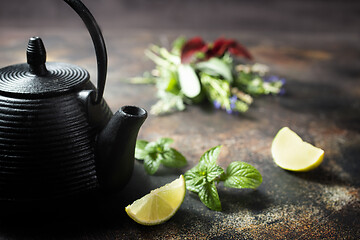 Image showing teapot and herb