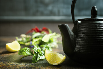 Image showing teapot and herb