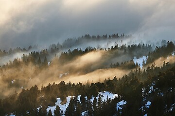 Image showing Misty winter snow mountain landscape