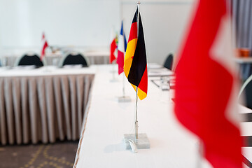 Image showing flags at international conference boardroom