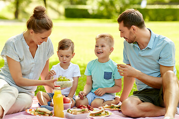 Image showing happy family having picnic at summer park