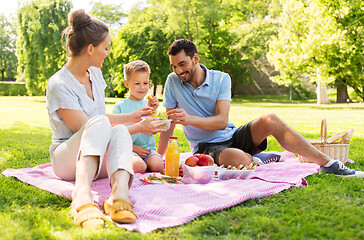 Image showing happy family having picnic at summer park