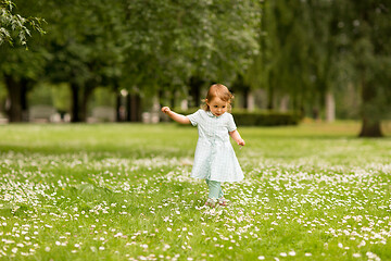 Image showing happy little baby girl at park in summer