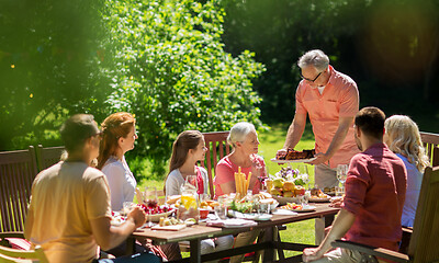 Image showing happy family having dinner or summer garden party