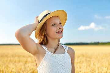 Image showing portrait of girl in straw hat on field in summer