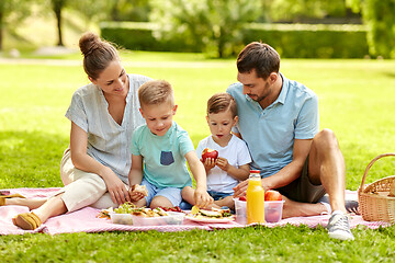 Image showing happy family having picnic at summer park