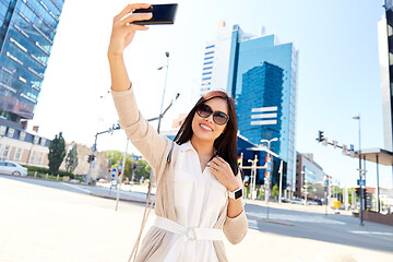 Image showing asian woman taking selfie by smartphone in city