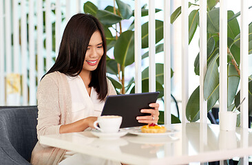 Image showing asian woman with tablet pc at cafe or coffee shop