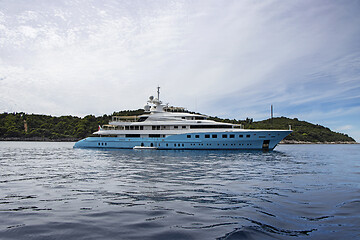 Image showing Blue luxury motor yacht, anchored in the calm sea