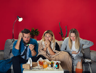 Image showing Ill young people, friends or family with fever and cold look suffering at home