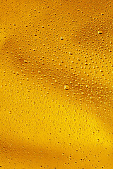 Image showing Close up view of cold drops on the glass of beer