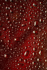 Image showing Close up view of cold drops on the glass of beer