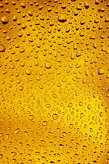 Image showing Close up view of cold drops on the glass of beer