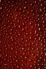 Image showing Close up view of cold drops on the glass of beer