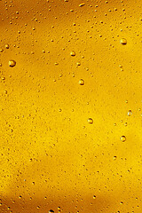 Image showing Close up view of cold drops on the glass of beer