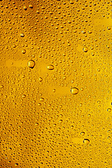 Image showing Close up view of cold drops on the glass of beer