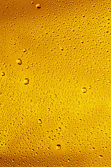 Image showing Close up view of cold drops on the glass of beer