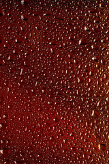 Image showing Close up view of cold drops on the glass of beer