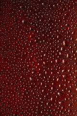 Image showing Close up view of cold drops on the glass of beer