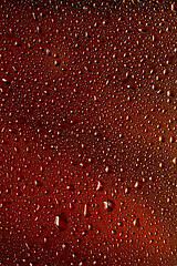 Image showing Close up view of cold drops on the glass of beer