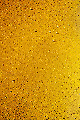 Image showing Close up view of cold drops on the glass of beer