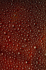 Image showing Close up view of cold drops on the glass of beer